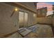Small backyard with a sliding door that leads to the home at 1043 Monte De Oro Ave, Las Vegas, NV 89183