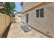 Small backyard with a sliding door that leads to the home at 1043 Monte De Oro Ave, Las Vegas, NV 89183