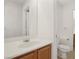 This bathroom offers a mirror and vanity, complete with toilet and a convenient access to the next room at 1043 Monte De Oro Ave, Las Vegas, NV 89183