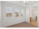 Bright bedroom featuring neutral walls, plush carpet, and ample natural light with attached bath area at 1043 Monte De Oro Ave, Las Vegas, NV 89183