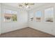Bright bedroom featuring neutral walls, plush carpet, and ample natural light from multiple windows at 1043 Monte De Oro Ave, Las Vegas, NV 89183