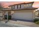 This two-story home has an attached two-car garage at 1043 Monte De Oro Ave, Las Vegas, NV 89183