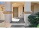 Inviting front door with decorative columns and a covered porch, providing a warm welcome at 1043 Monte De Oro Ave, Las Vegas, NV 89183