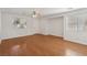 Open living space with hardwood floors and a white front door with windows at 1043 Monte De Oro Ave, Las Vegas, NV 89183