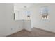 Cozy loft with neutral carpet and ample natural light from multiple windows at 1043 Monte De Oro Ave, Las Vegas, NV 89183