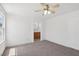 Bright bedroom featuring carpet, a ceiling fan, and an ensuite bathroom at 1043 Monte De Oro Ave, Las Vegas, NV 89183