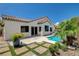 A charming backyard featuring a refreshing pool, patio, and well-maintained landscaping at 10608 Trussell St, Las Vegas, NV 89141