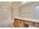Neutral bathroom featuring a single sink vanity, toilet, and bathtub with shower at 10608 Trussell St, Las Vegas, NV 89141