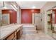 Elegant bathroom with double vanity, soaking tub, separate shower, and sleek finishes for a spa-like experience at 10608 Trussell St, Las Vegas, NV 89141