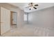 Bedroom with new carpet, modern ceiling fan, and views of front entry offers a comfortable retreat at 10608 Trussell St, Las Vegas, NV 89141