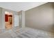 Spacious bedroom with doorway to ensuite bathroom, neutral walls, and bright natural light, perfect for relaxation at 10608 Trussell St, Las Vegas, NV 89141