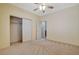 Bedroom featuring a ceiling fan, closet with bi-fold doors and neutral walls at 10608 Trussell St, Las Vegas, NV 89141