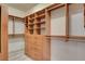 Walk-in closet with custom shelving and drawers, providing ample storage and organization solutions at 10608 Trussell St, Las Vegas, NV 89141