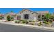Single-story home featuring desert landscaping, stone accents, and a well-maintained lawn at 10608 Trussell St, Las Vegas, NV 89141