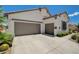 Spacious three car garage with mature landscaping, offering ample parking and curb appeal at 10608 Trussell St, Las Vegas, NV 89141