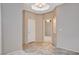Inviting hallway with neutral colors and recessed lighting, leading to various rooms within the home at 10608 Trussell St, Las Vegas, NV 89141