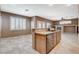 Kitchen with a breakfast bar, stainless steel dishwasher, and backyard view at 10608 Trussell St, Las Vegas, NV 89141