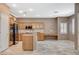 Spacious kitchen features wood cabinets, stainless steel appliances and tile flooring at 10608 Trussell St, Las Vegas, NV 89141