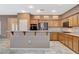 Kitchen offers stainless steel appliances, tile backsplash and breakfast bar seating at 10608 Trussell St, Las Vegas, NV 89141