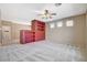 Bright living room featuring built-in shelving and neutral color scheme, perfect for entertaining or relaxing at 10608 Trussell St, Las Vegas, NV 89141
