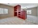 Living room features a red, built in entertainment center at 10608 Trussell St, Las Vegas, NV 89141