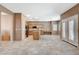 Open concept living area with tile flooring, a view of the kitchen, and natural light at 10608 Trussell St, Las Vegas, NV 89141