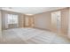 Bright and airy living room with tile and carpet flooring and neutral paint colors at 10608 Trussell St, Las Vegas, NV 89141