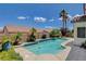 Inviting pool with lush landscaping, patio, and blue skies in backyard at 10608 Trussell St, Las Vegas, NV 89141