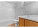 Clean bathroom features a shower-tub combo, a toilet, and a vanity with a sink, offering practical comfort at 10638 Pueblo Springs St, Las Vegas, NV 89183
