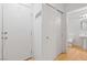 A half bathroom features wood floors and a pedestal sink at 10638 Pueblo Springs St, Las Vegas, NV 89183