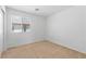Bedroom with carpet, a window with blinds, and neutral walls at 10638 Pueblo Springs St, Las Vegas, NV 89183