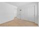 Neutral bedroom with carpet, closet, and door leading to landing at 10638 Pueblo Springs St, Las Vegas, NV 89183