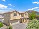Charming two-story home features a tile roof, well-manicured landscaping, and an attached two-car garage at 10638 Pueblo Springs St, Las Vegas, NV 89183