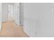 Hallway with carpeted floors and white walls showcasing multiple doorways at 10638 Pueblo Springs St, Las Vegas, NV 89183