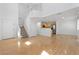 Inviting living space includes hardwood floors, a staircase, and open access to the kitchen, perfect for Gathering gatherings at 10638 Pueblo Springs St, Las Vegas, NV 89183
