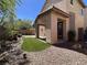 Backyard features a covered patio, artificial turf, and low-maintenance landscaping at 11237 Newbury Hills Ave, Las Vegas, NV 89138