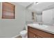 Neutral bathroom featuring wood blinds, a mirror, and a single sink at 11237 Newbury Hills Ave, Las Vegas, NV 89138