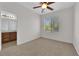 Bedroom featuring carpeted floors, natural lighting, and a ceiling fan at 11237 Newbury Hills Ave, Las Vegas, NV 89138