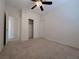 Bright carpeted bedroom with ceiling fan, closet, and neutral walls offers a comfortable retreat at 11237 Newbury Hills Ave, Las Vegas, NV 89138