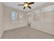 Bedroom with carpeted floors, a ceiling fan, and natural lighting at 11237 Newbury Hills Ave, Las Vegas, NV 89138