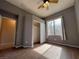 Cozy bedroom with neutral paint, good natural light from window, and adjacent access to additional spaces at 11237 Newbury Hills Ave, Las Vegas, NV 89138