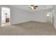 Bright bedroom with carpet and ceiling fan, seamlessly connected to the bathroom, offers a harmonious private suite at 11237 Newbury Hills Ave, Las Vegas, NV 89138