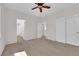 Bright bedroom boasts ample storage with closet doors and neutral carpeting, offering a clean and spacious feel at 11237 Newbury Hills Ave, Las Vegas, NV 89138