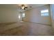 Bright bonus room, carpeted, with large windows and arched openings; a great flexible space for different needs at 11237 Newbury Hills Ave, Las Vegas, NV 89138