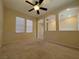 Large bonus room with plush carpet, windows for natural light, and ample space for a variety of activities at 11237 Newbury Hills Ave, Las Vegas, NV 89138