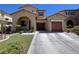 Charming two-story home with a well-manicured lawn, two-car garage, and beautiful archway entry, great curb appeal at 11237 Newbury Hills Ave, Las Vegas, NV 89138