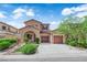 Charming two-story home with two-car garage, inviting entry and manicured landscaping at 11237 Newbury Hills Ave, Las Vegas, NV 89138