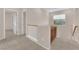 Hallway featuring carpeted floors, natural lighting, and a cabinet at 11237 Newbury Hills Ave, Las Vegas, NV 89138