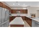 Stylish kitchen with stainless steel appliances, island and ample cabinet space at 11237 Newbury Hills Ave, Las Vegas, NV 89138