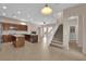 Open kitchen with a center island, stainless steel appliances and a staircase nearby at 11237 Newbury Hills Ave, Las Vegas, NV 89138